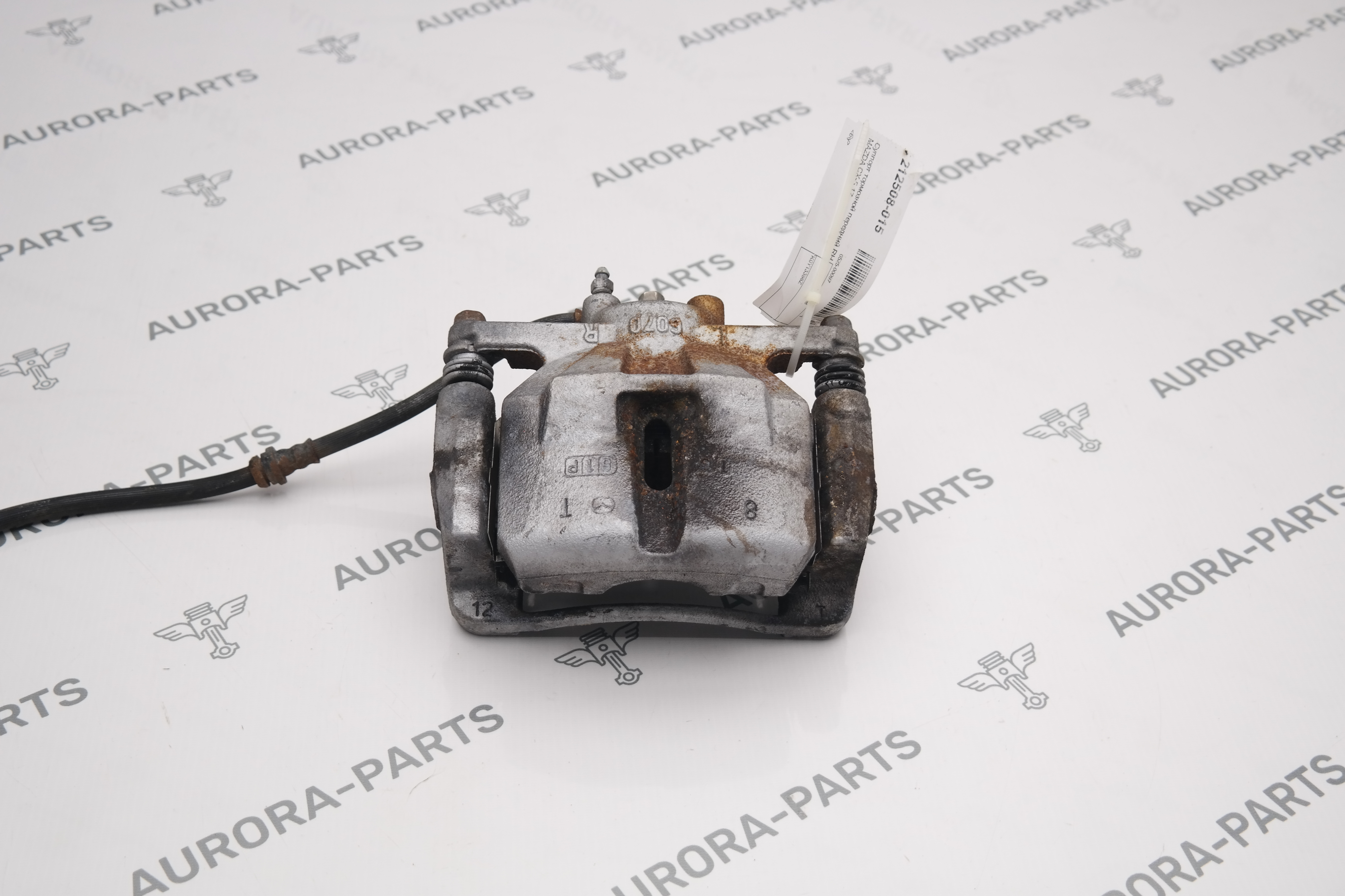 Суппорт тормозной передний RH Mazda CX-5