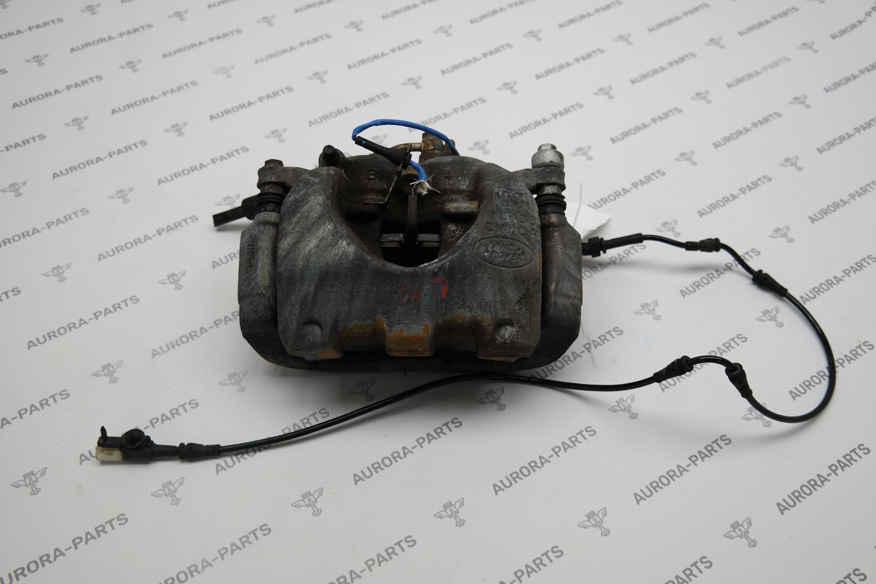 Суппорт тормозной передний LH Land Rover Discovery