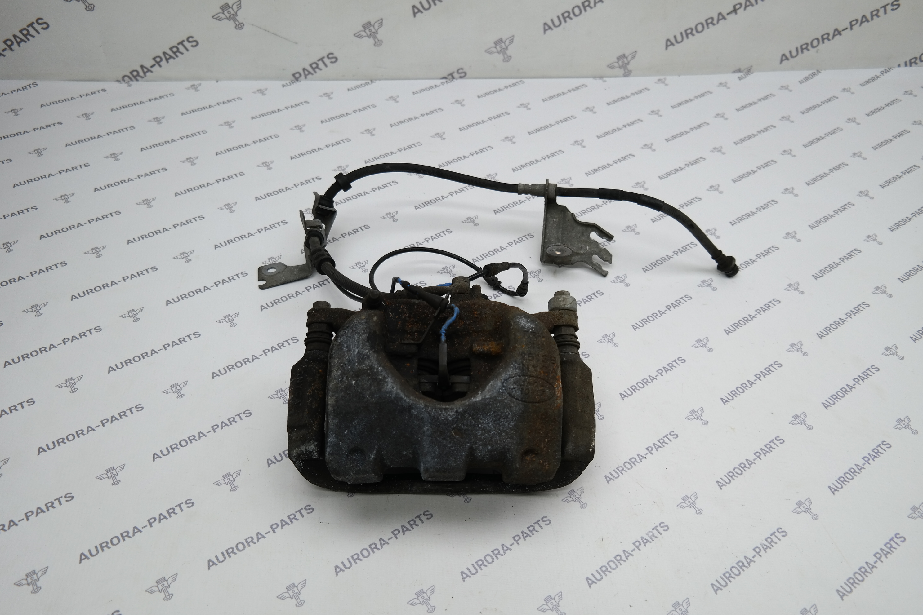 Суппорт тормозной передний LH Land Rover Discovery