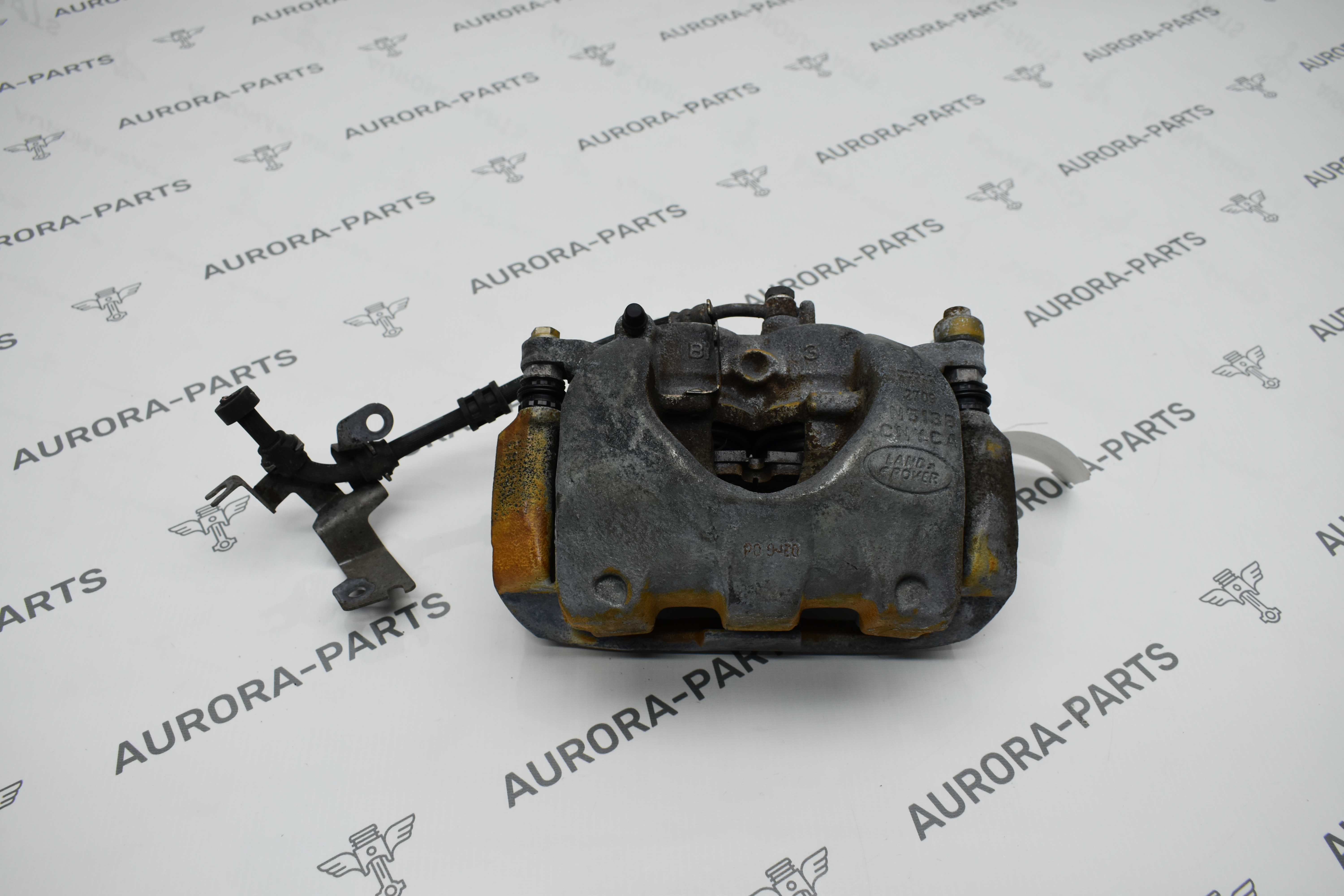 Суппорт тормозной передний LH Land Rover Discovery