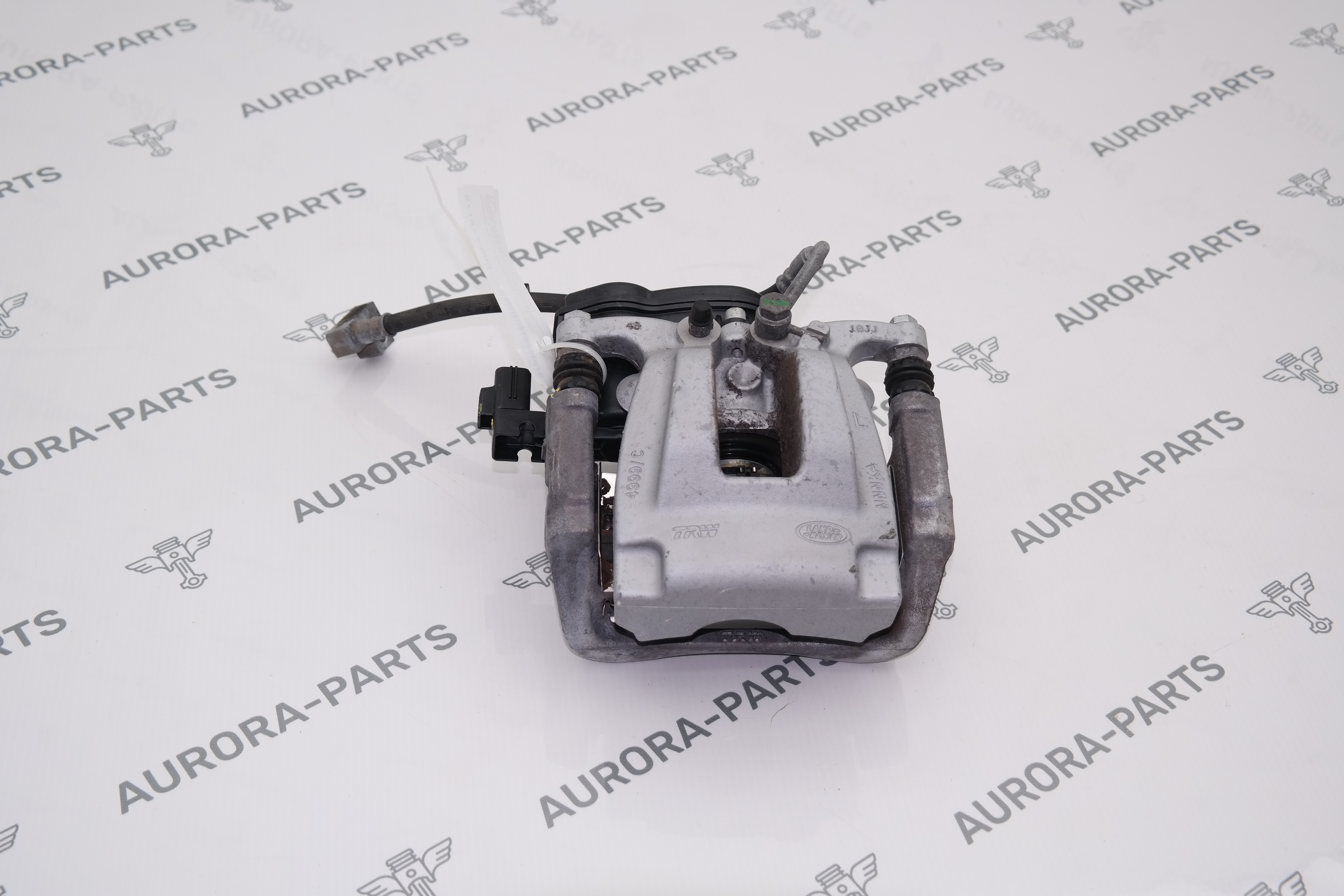 Суппорт тормозной заднего колеса в сборе со скобой LH Land Rover Discovery