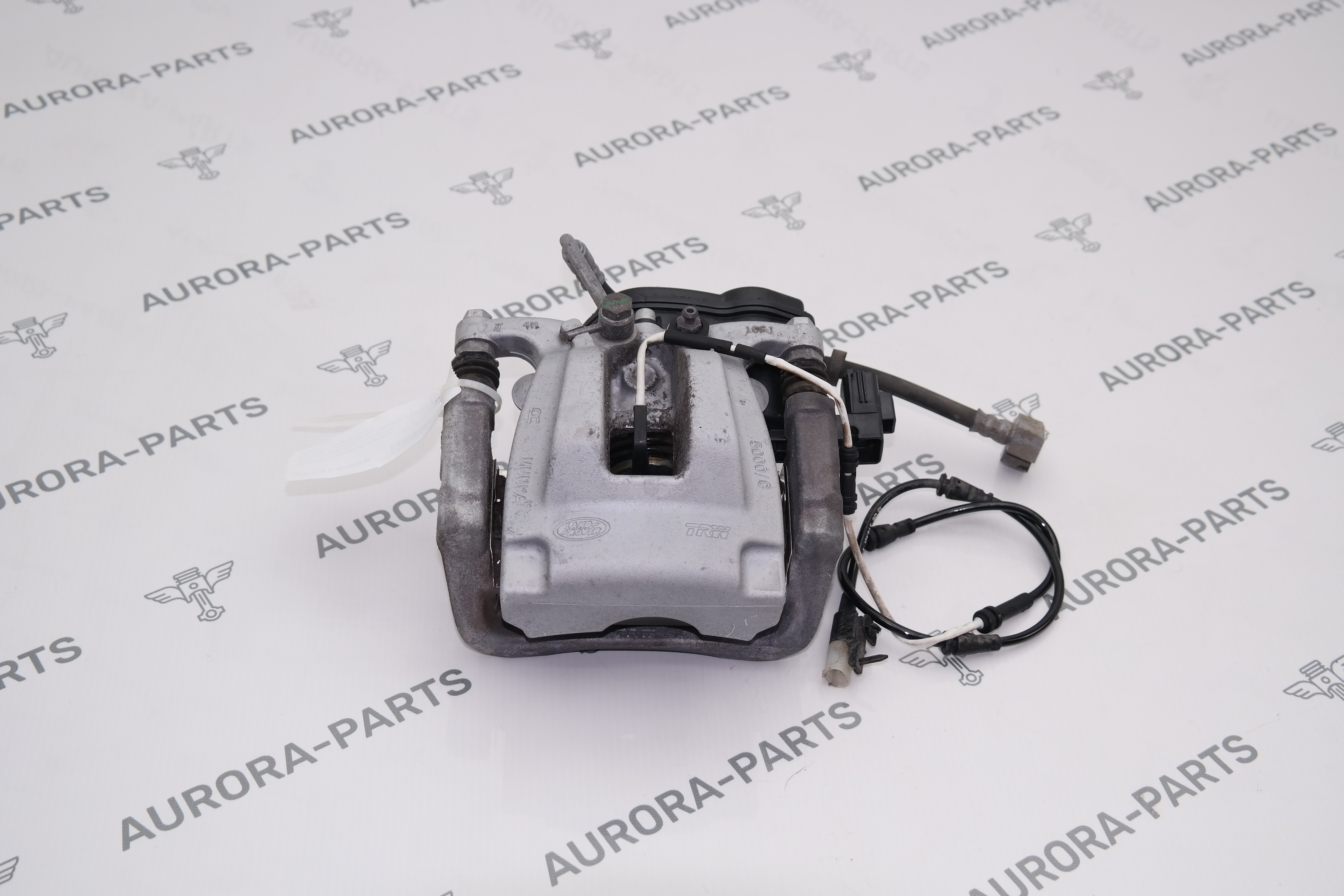 Суппорт тормозной заднего колеса в сборе со скобой RH Land Rover Discovery