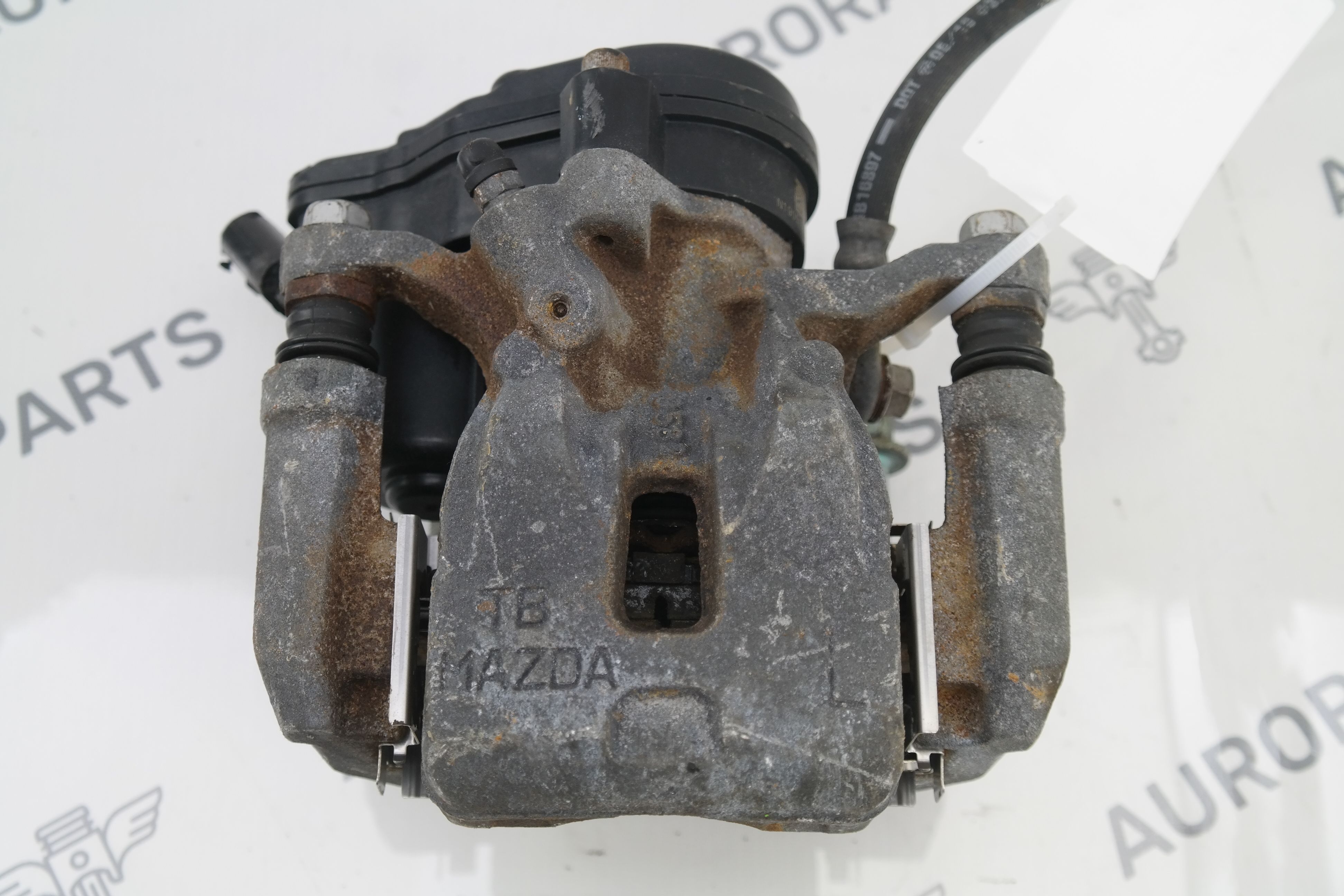 Суппорт тормозной задний в сборе (Дефект фишки) LH Mazda CX-5