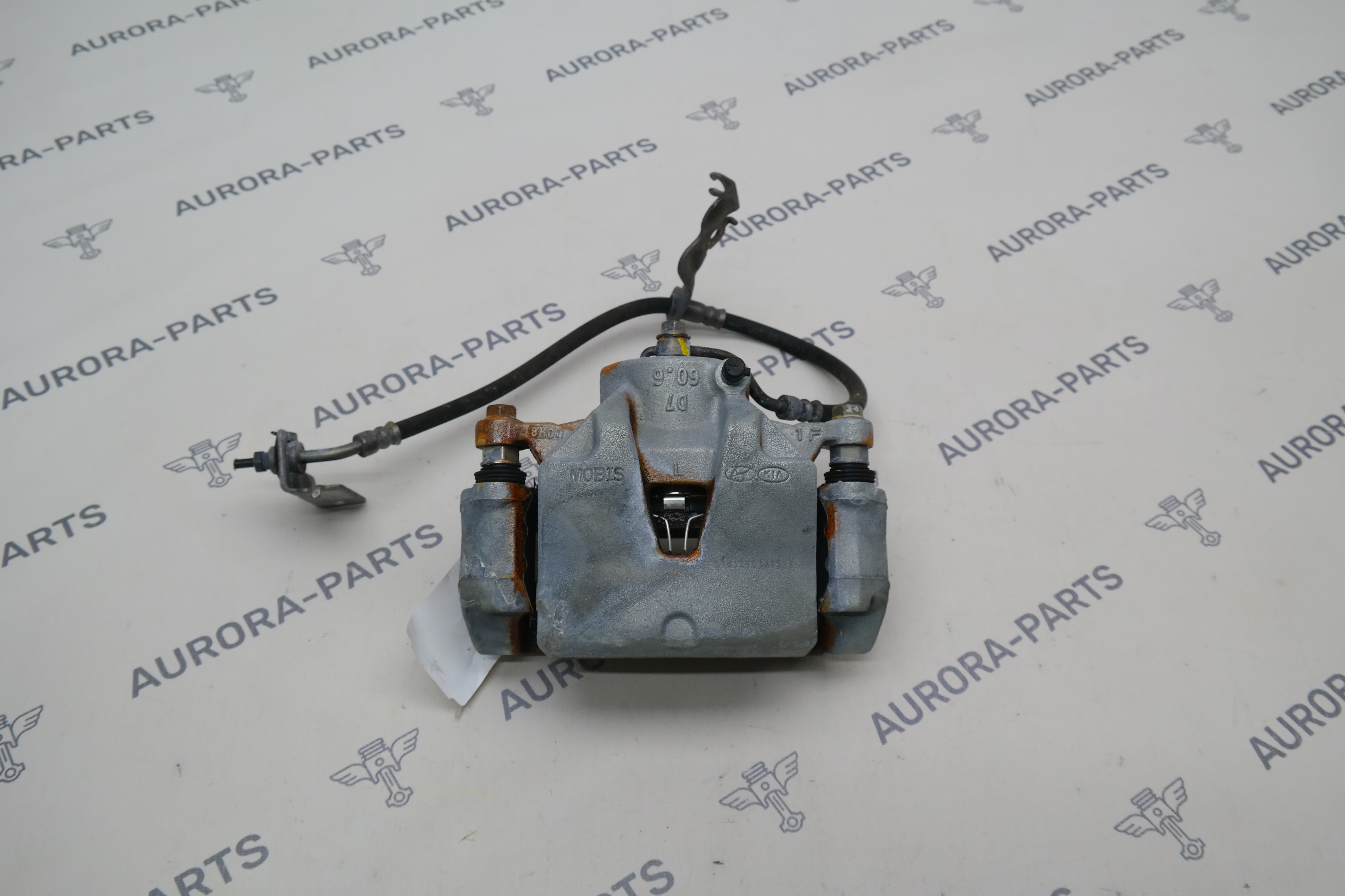 Суппорт тормозной передний LH Kia Sportage