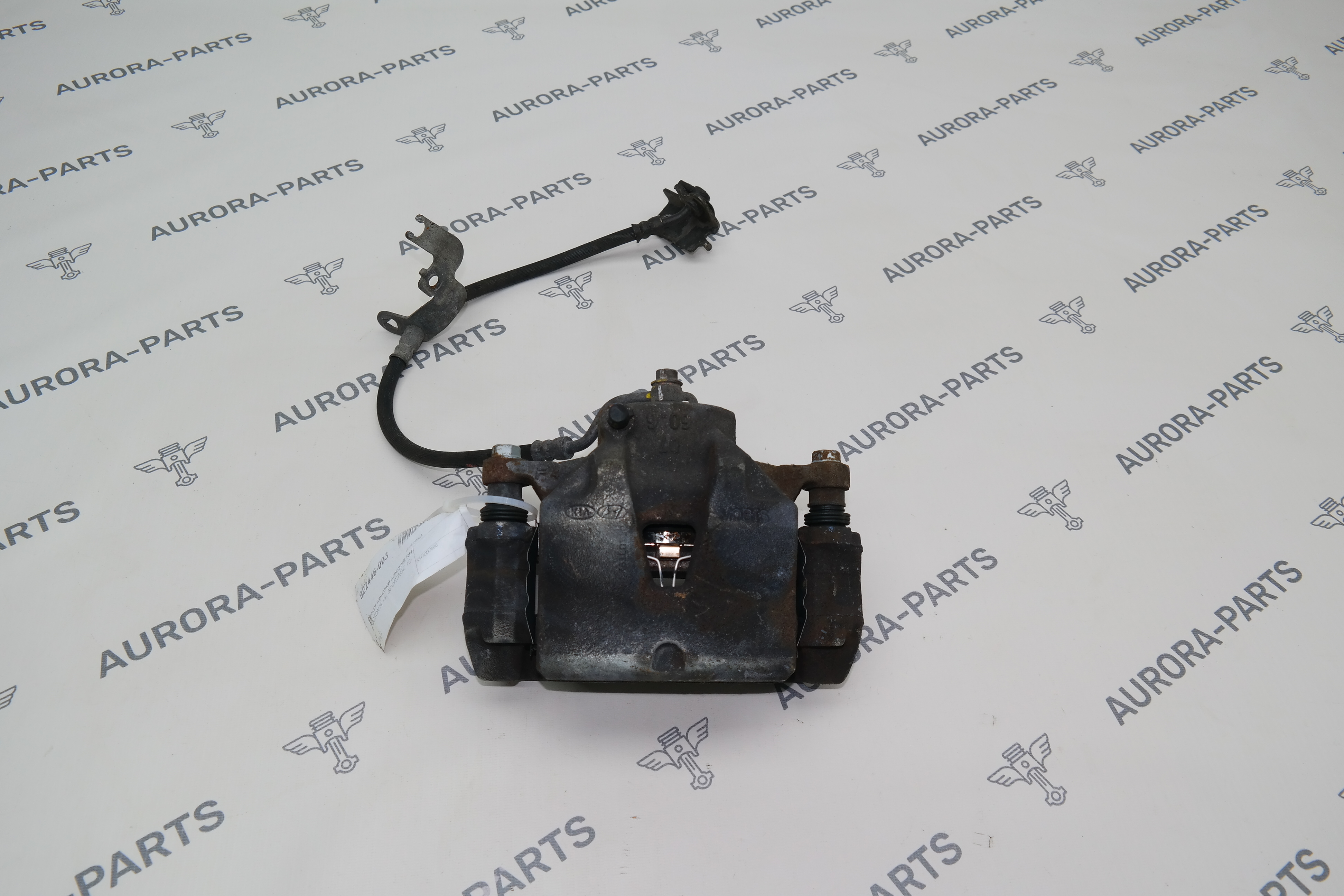 Суппорт тормозной передний RH Kia Sportage