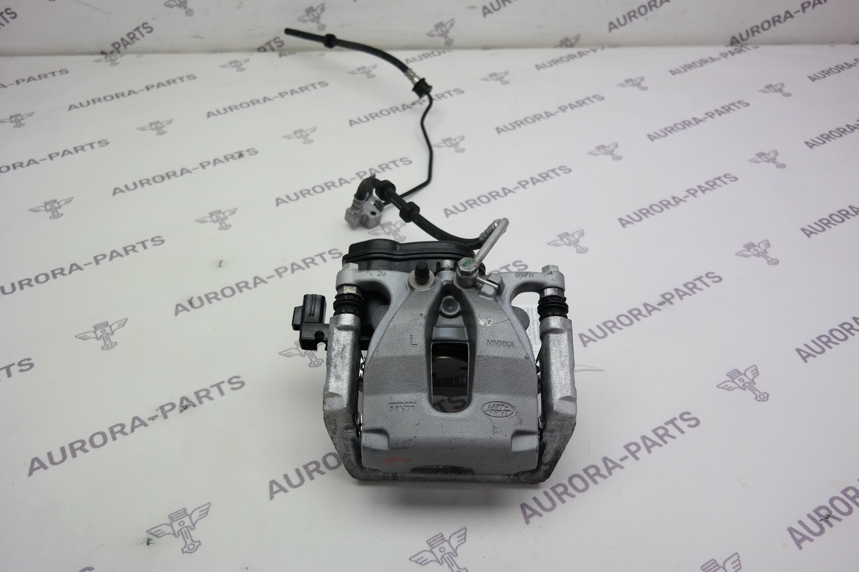 Суппорт тормозной заднего колеса в сборе со скобой LH Land Rover Defender